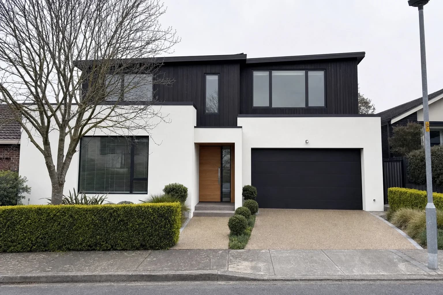 Render and charred-timber facade